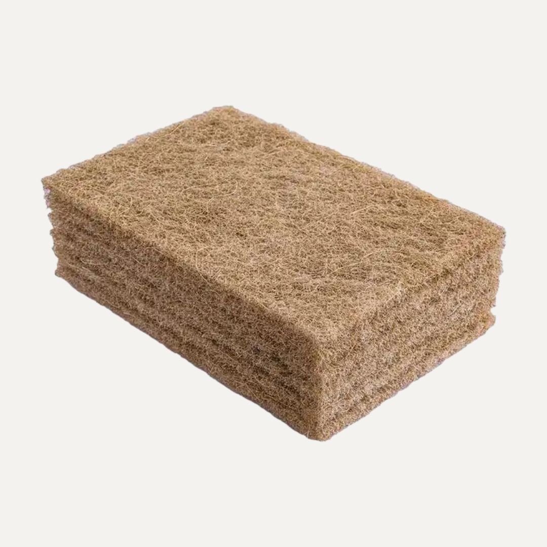 Rectangular sanding block with sandpaper texture on a white background. Simply Clean Coconut Scourers