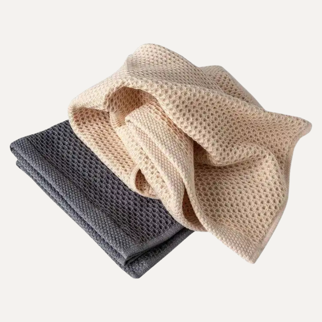 Two folded towels, one beige and one gray, on a white background. Simply Clean Cotton Wash Cloth - 2 Pack