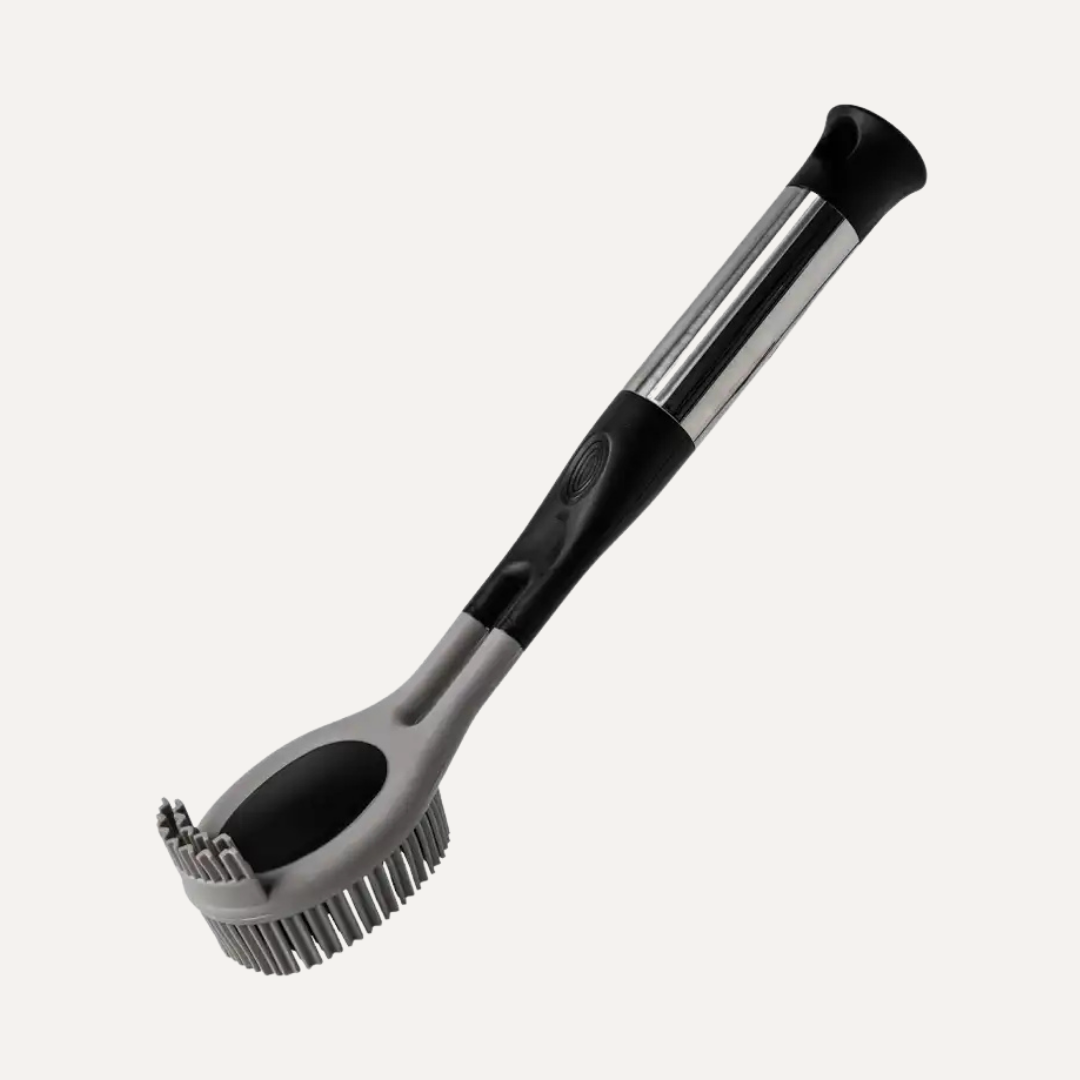Cleaning brush with black handle and silver bristle head on a white background. Simply Clean TPR Round Rubber Kitchen Brush