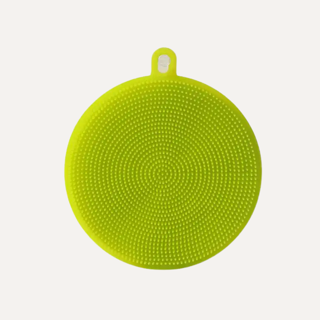 Green silicone trivet with textured surface on a white background. Simply Clean Silicone Scrubber